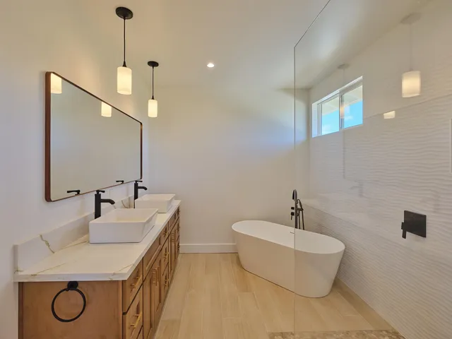 a bathroom with a bathtub and shower