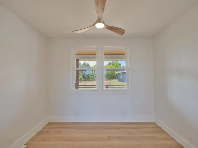 a bathroom with a toilet a sink and a mirror