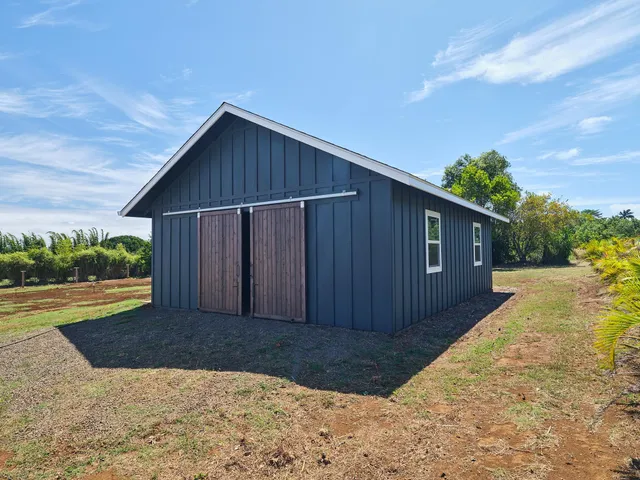 an aerial view of houses with a yard