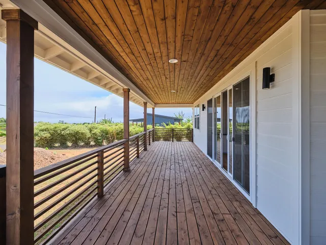 a view of balcony with wooden floor
