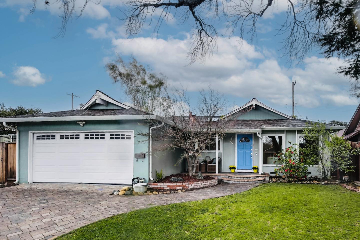front view of a house with a yard