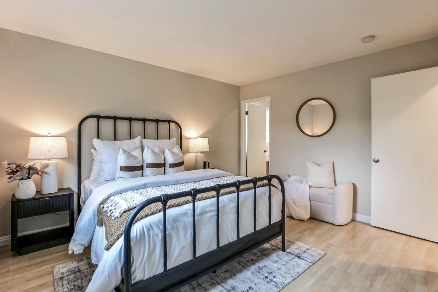 744 Cornell Drive Santa Clara, CA 95051 - Photo 11 of 19 a bed room with a bed and painting on the wall