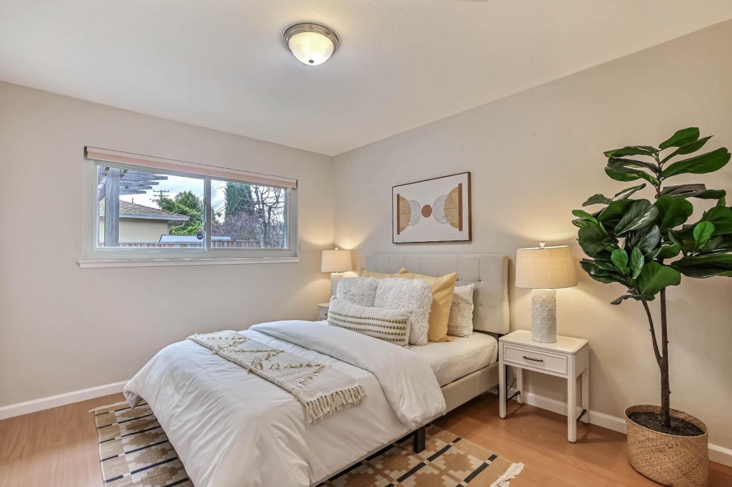 744 Cornell Drive Santa Clara, CA 95051 - Photo 14 of 19 a bedroom with a bed lamp and window
