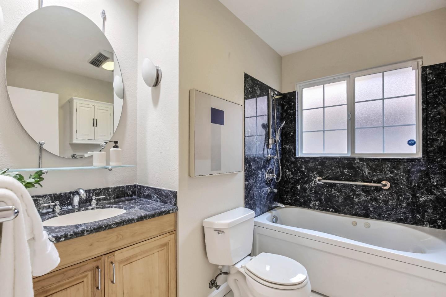 744 Cornell Drive Santa Clara, CA 95051 - Photo 16 of 19 a bathroom with a granite countertop sink toilet and shower