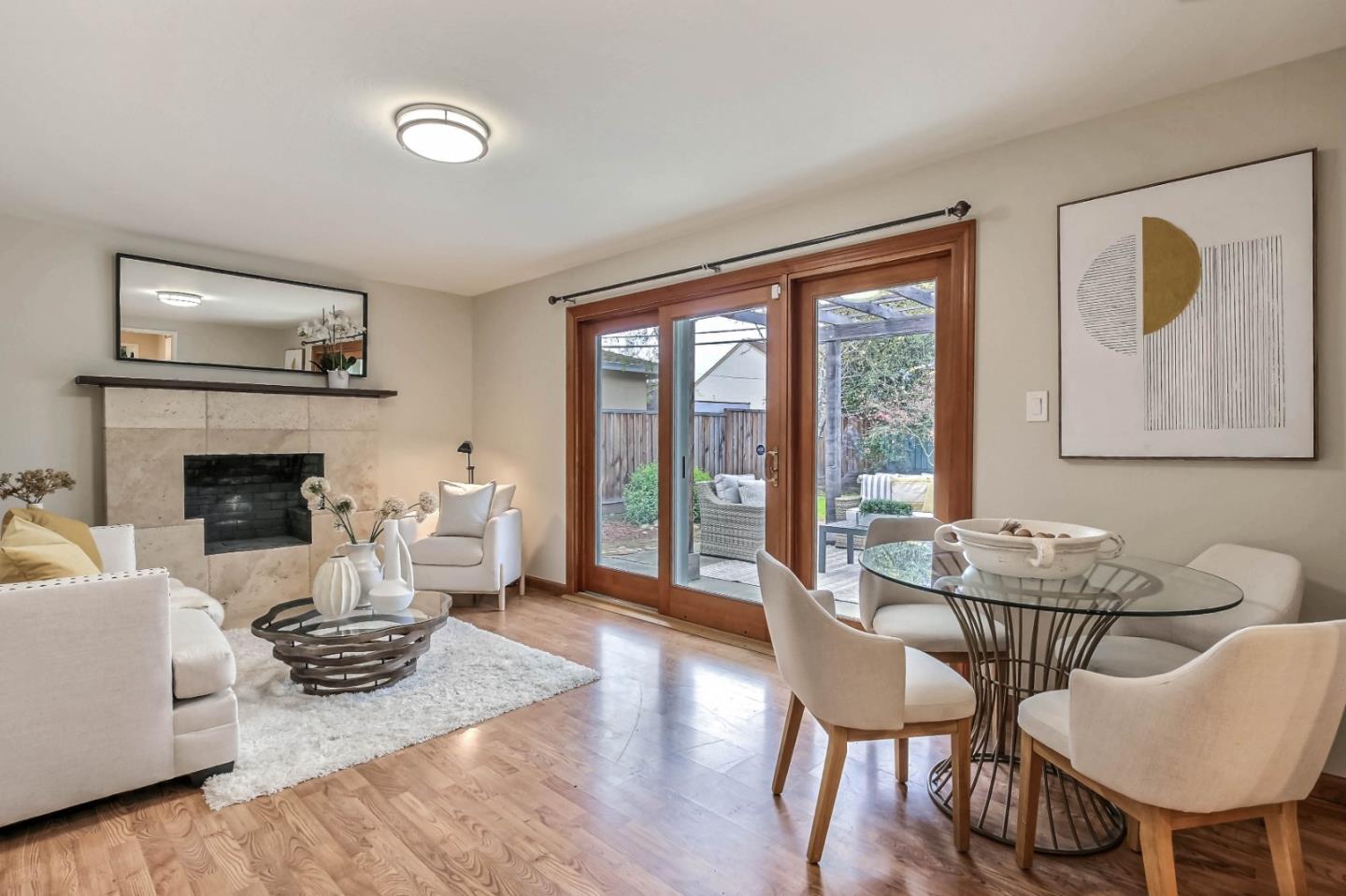 744 Cornell Drive Santa Clara, CA 95051 - Photo 5 of 19 a living room with furniture a table and a fireplace