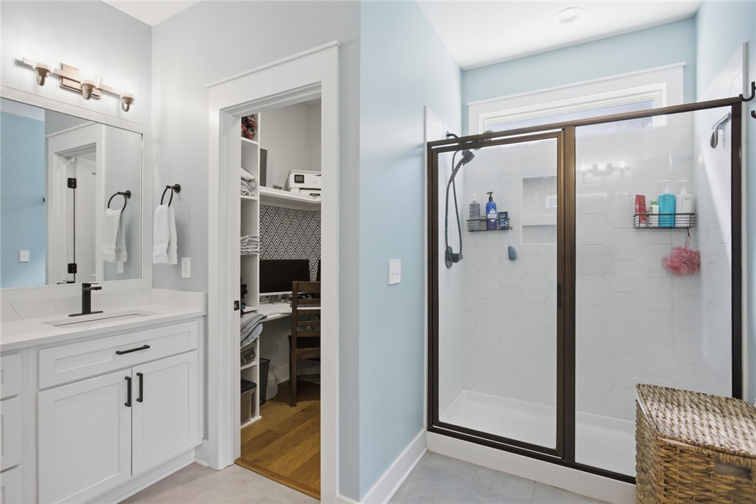 318 Summerall Drive Anderson, SC 29621 - Photo 31 of 42 This bright bathroom features a vanity with ample storage and a contemporary walk-in shower.
