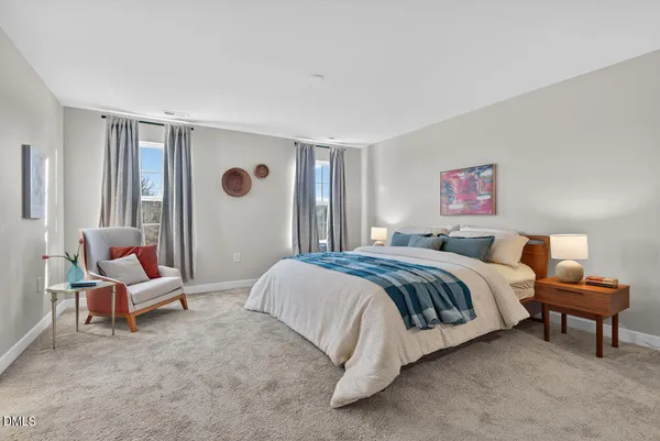 a bedroom with a bed and a couch