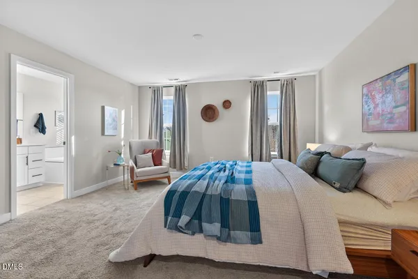 a bedroom with a bed and a couch