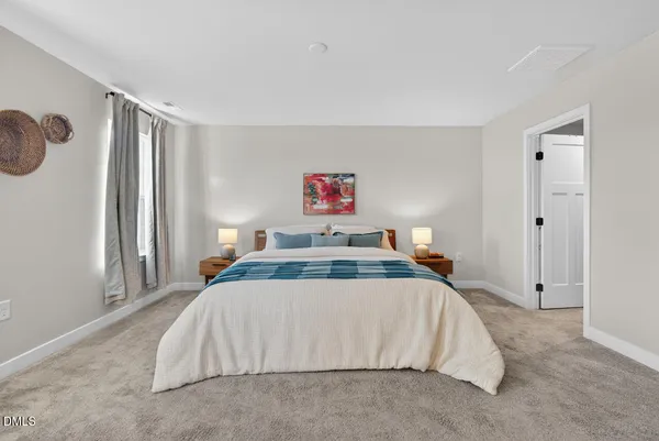 a bathroom with a sink tub double vanity and a mirror