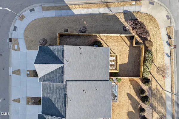 an aerial view of a house with outdoor space