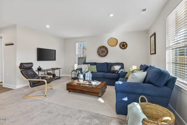 a living room with furniture and rug