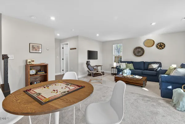 a living room with furniture rug and window