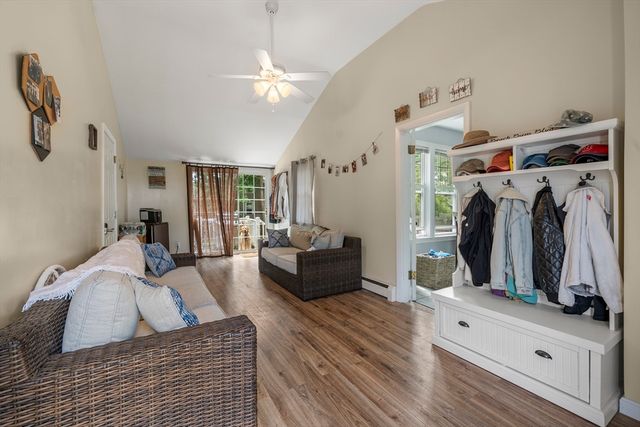 a living room with furniture and a walk in closet