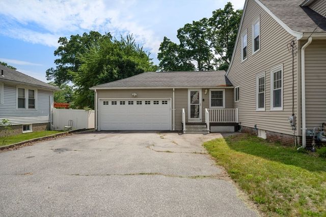 a house with yard in front of it