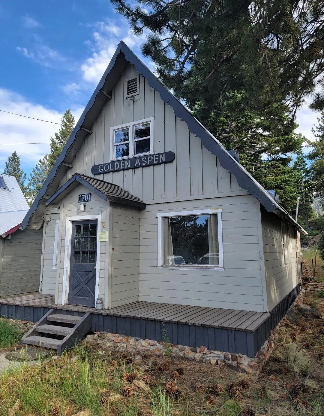 1701 Old Mammoth Road, Unit 2 Mammoth Lakes, CA 93546 - Photo 1 of 7 a front view of a house with balcony