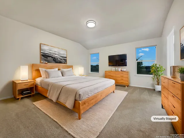 a bedroom with a bed and glass wall