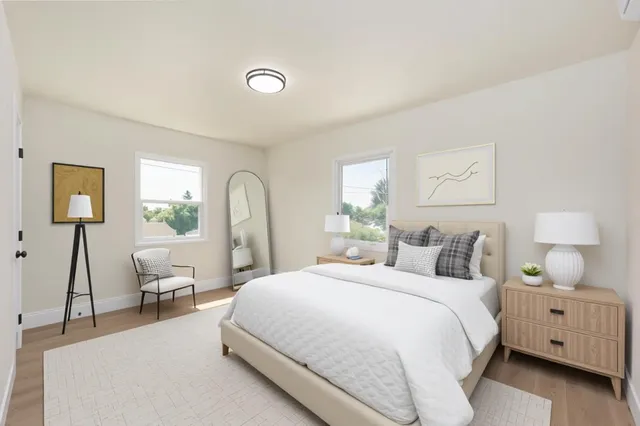 a bedroom with a bed and a lamp