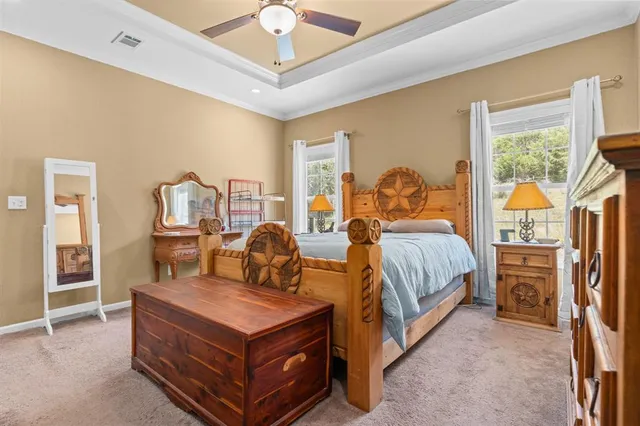 a living room with bed furniture and a window
