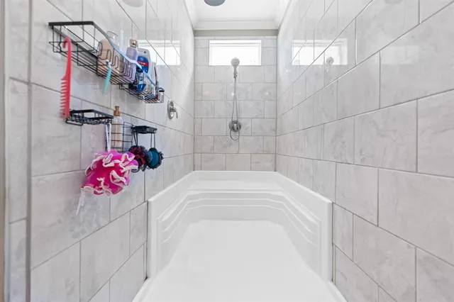a bathroom with a white bath tub