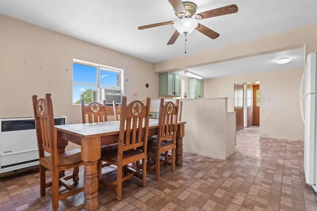 a view of dining room and hall with wooden floor