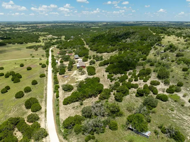 a bathroom with a shower and a mirror