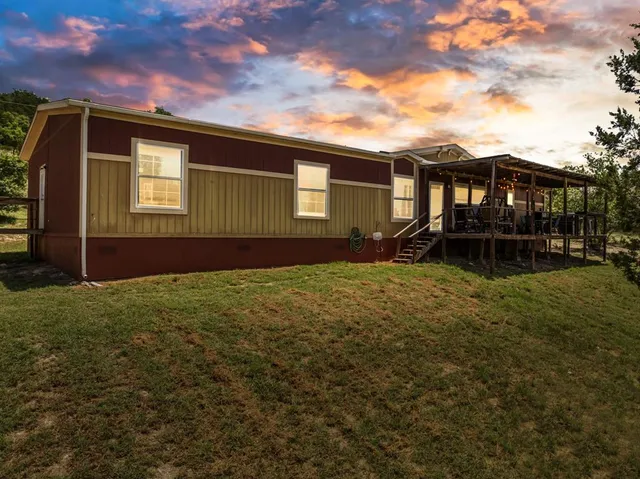 a backyard of a house with lots of green space
