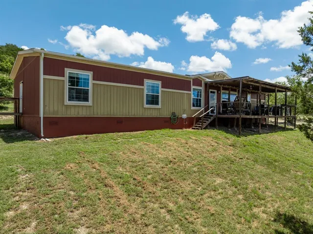 a backyard of a house with lots of green space