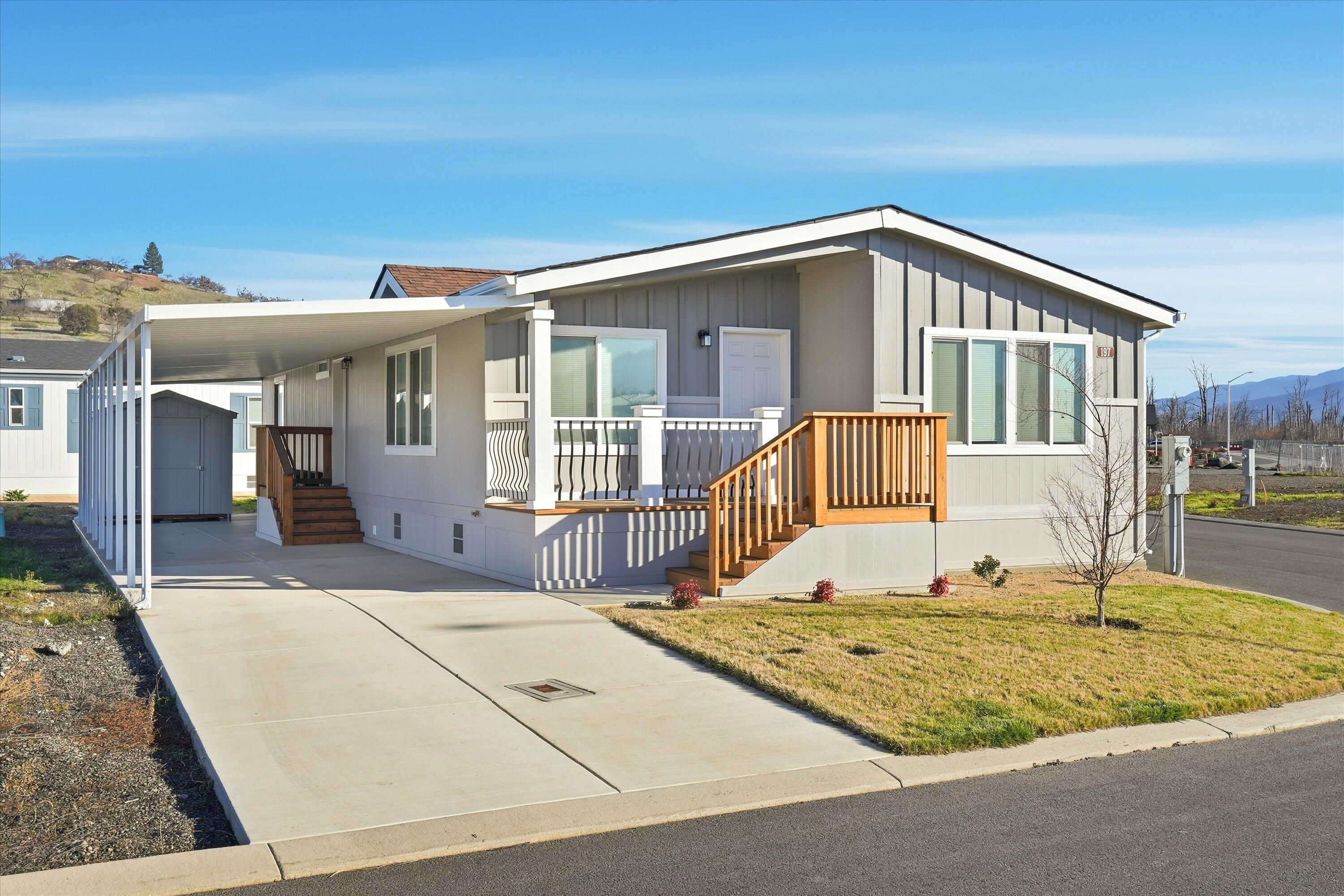 300 Luman Road, Unit 197 Phoenix, OR 97535 - Photo 1 of 26 a front view of a house with a swimming pool