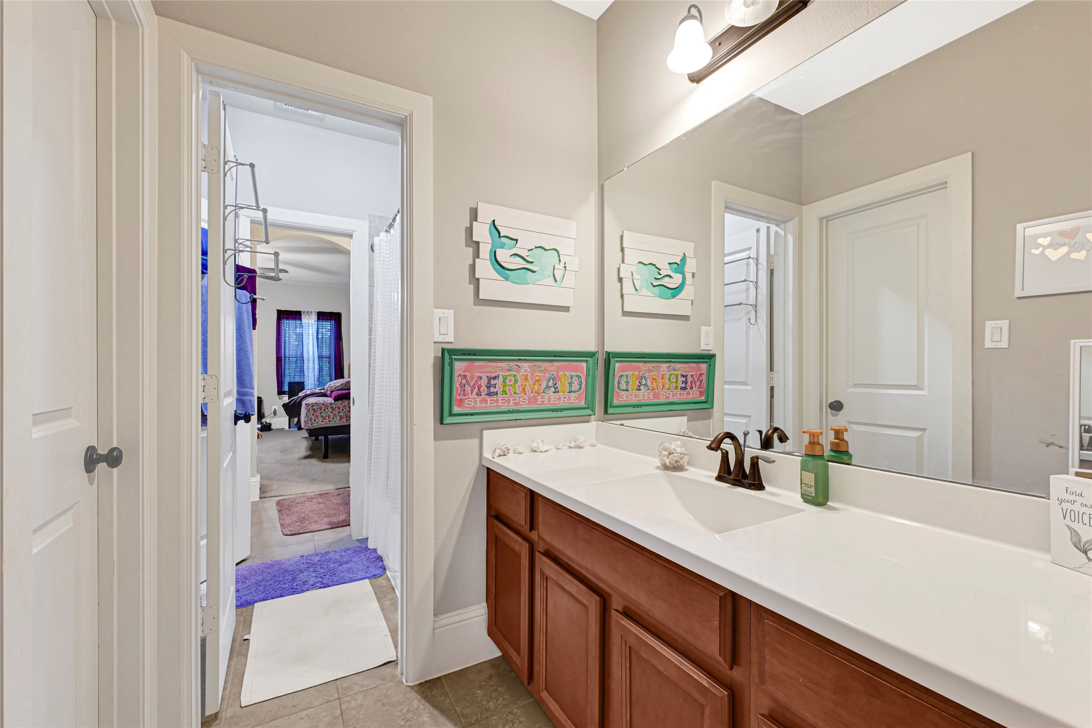 14002 Cole Point Drive Humble, TX 77396 - Photo 17 of 23 a en suite bathroom with a sink double vanity and a shower
