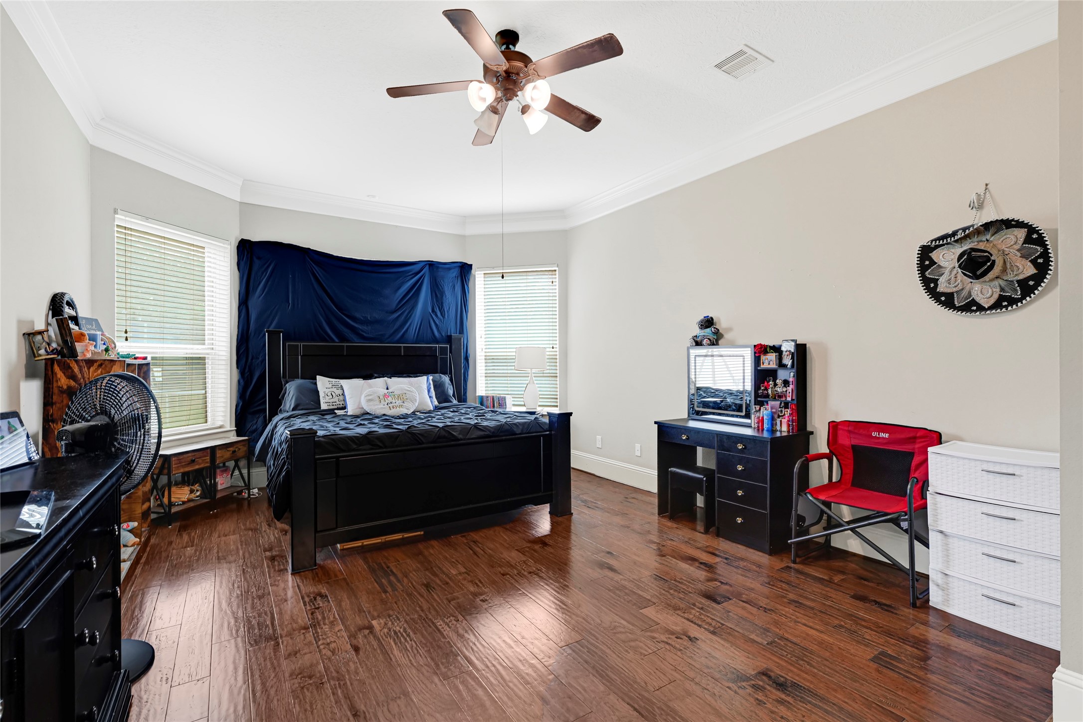 14002 Cole Point Drive Humble, TX 77396 - Photo 10 of 23 a bedroom with a bed and wooden floor