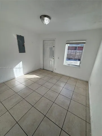 a view of an empty room and window