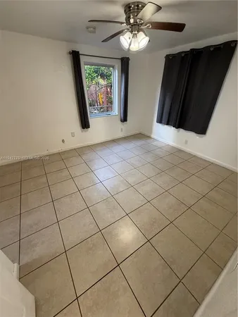 a view of an empty room and wooden floor