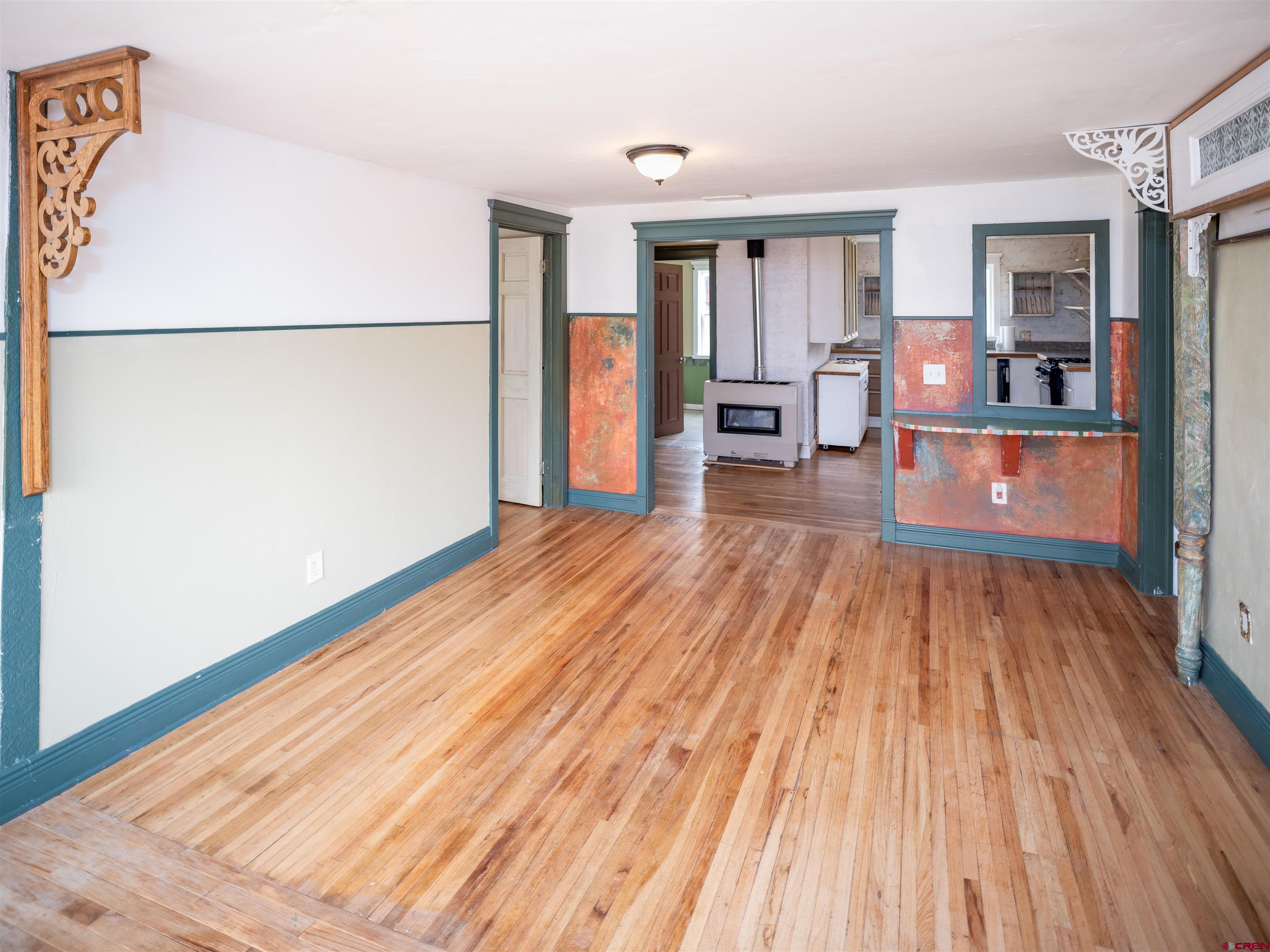 312 North Beech Street Cortez, CO 81321 - Photo 12 of 37 a room with wooden floor and electronic appliances
