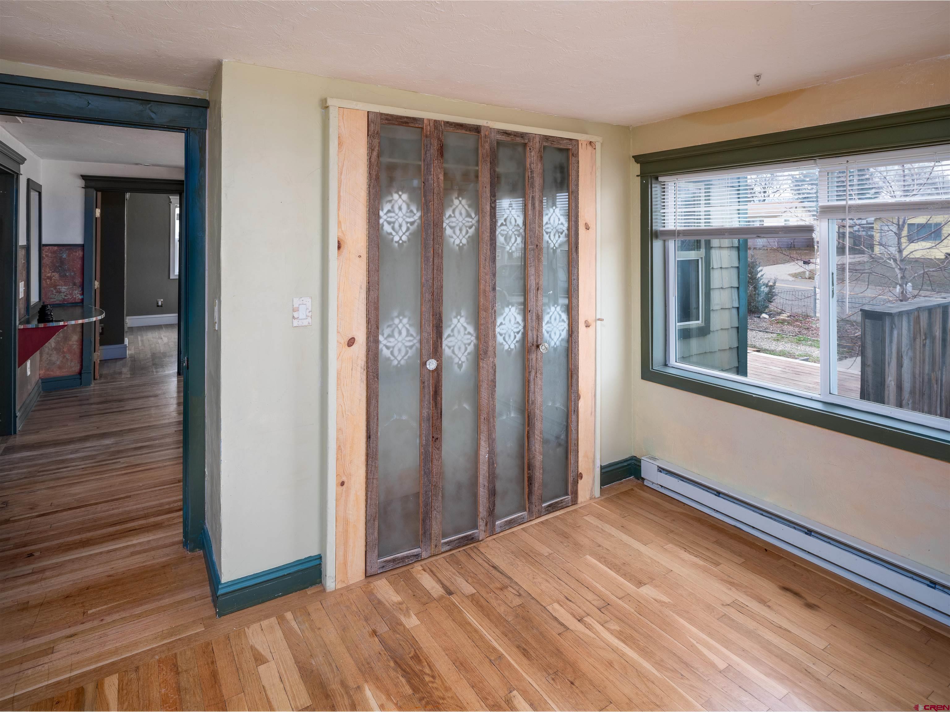 312 North Beech Street Cortez, CO 81321 - Photo 13 of 37 a view of a room with wooden floor and walls