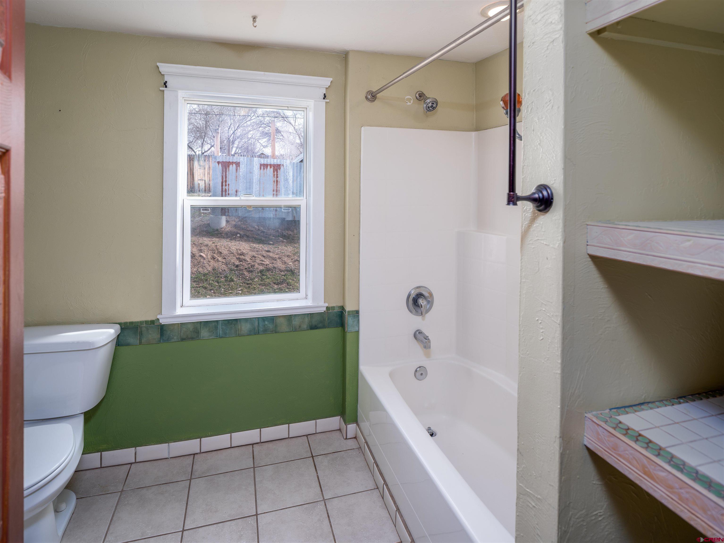 312 North Beech Street Cortez, CO 81321 - Photo 18 of 37 a bathroom with a sink a toilet and a bathtub