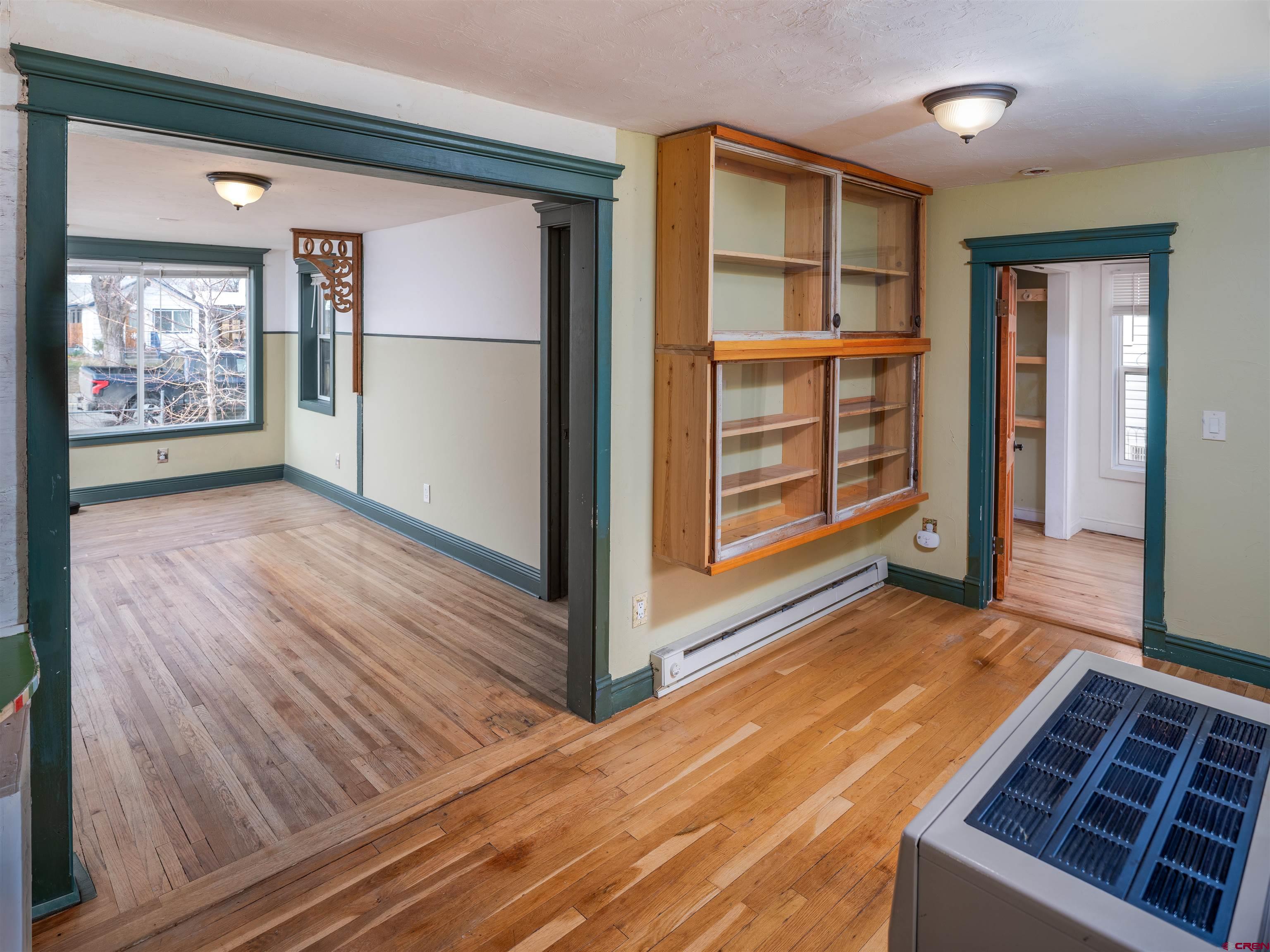 312 North Beech Street Cortez, CO 81321 - Photo 19 of 37 a view of an empty room with wooden floor and a window