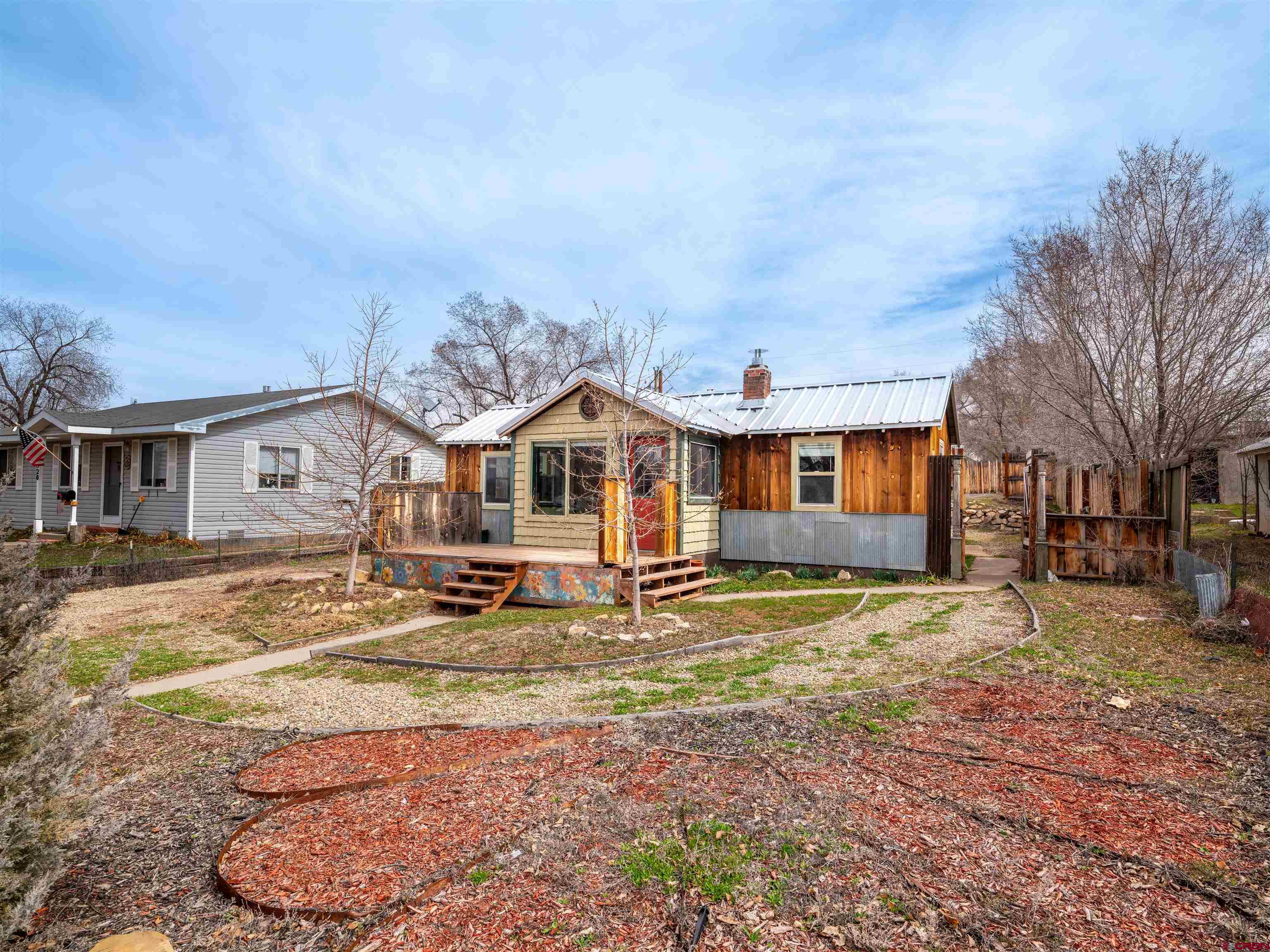 312 North Beech Street Cortez, CO 81321 - Photo 26 of 37 a view of a house with backyard