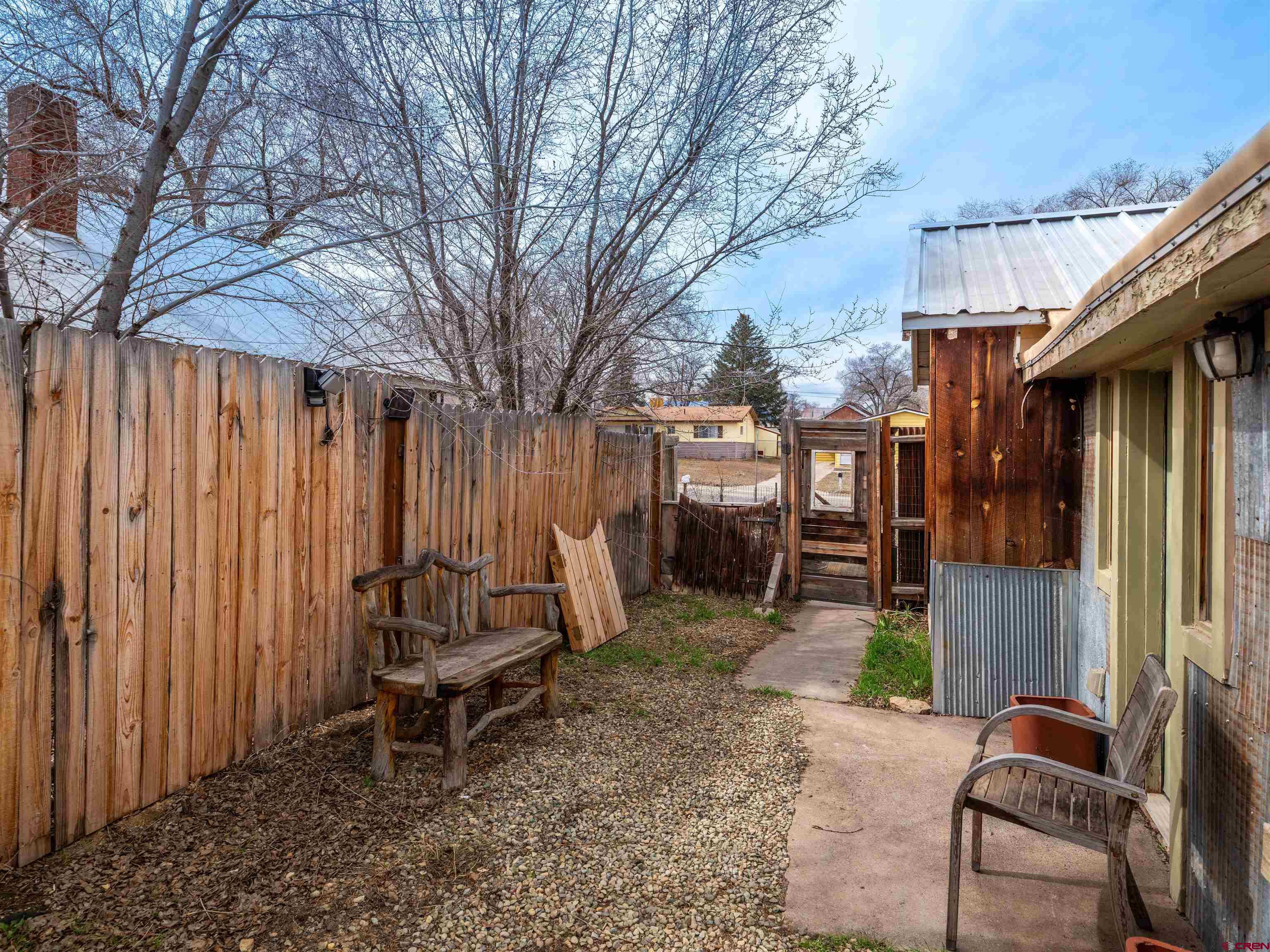 312 North Beech Street Cortez, CO 81321 - Photo 29 of 37 a view of a chair and tables in the patio in front of a house