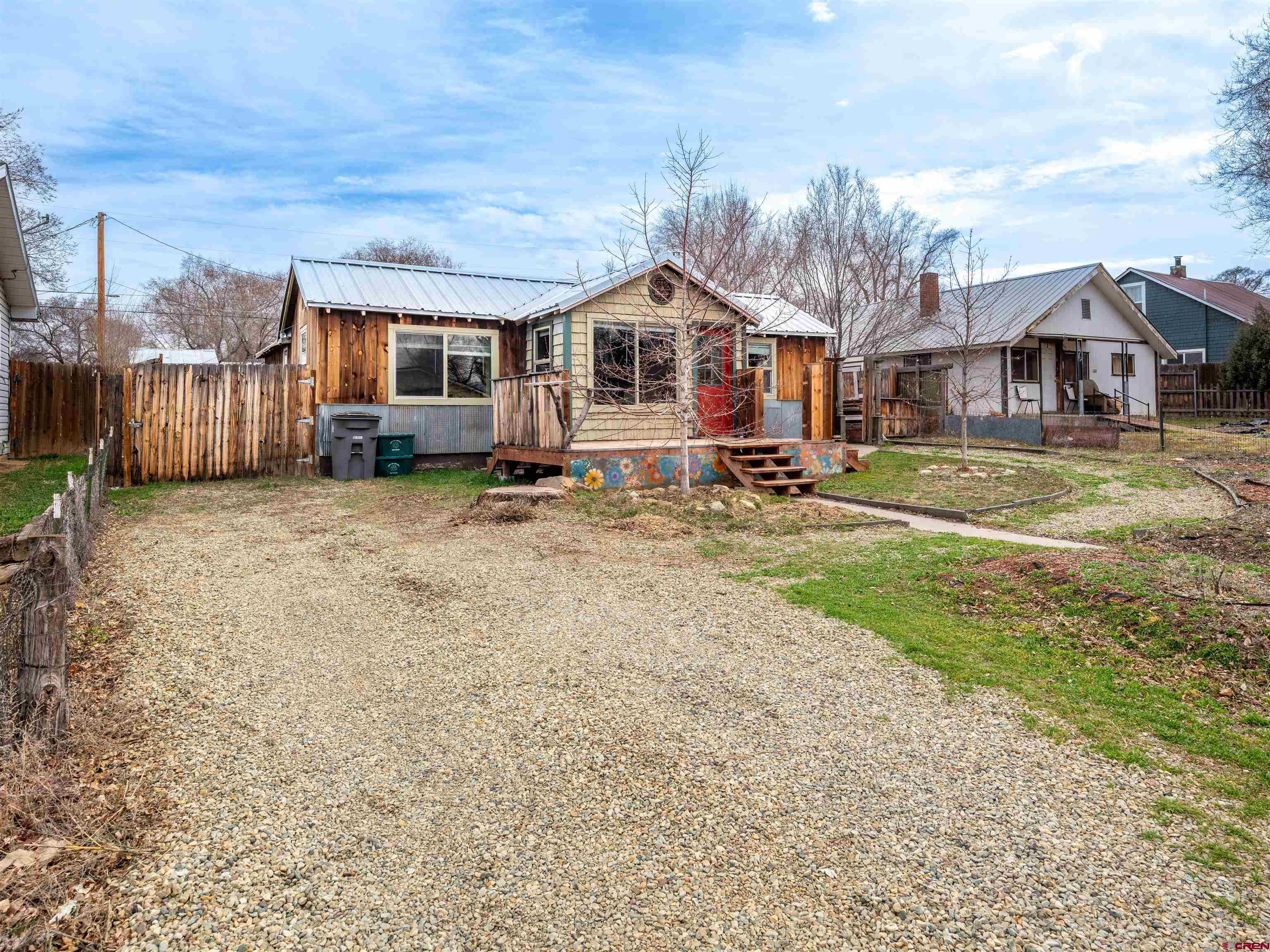 312 North Beech Street Cortez, CO 81321 - Photo 5 of 37 a front view of a house with a yard