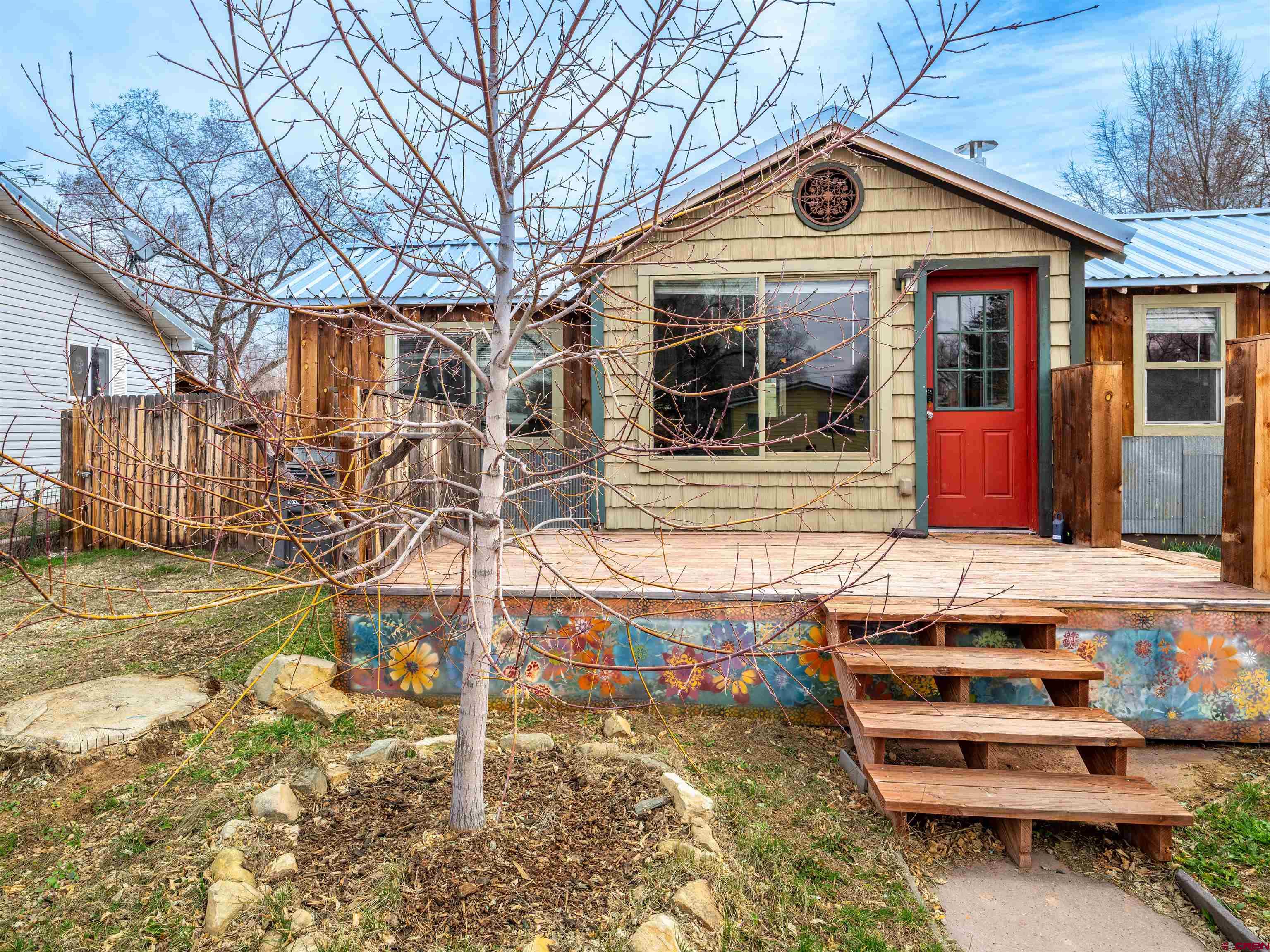 312 North Beech Street Cortez, CO 81321 - Photo 6 of 37 a front view of a house with garden