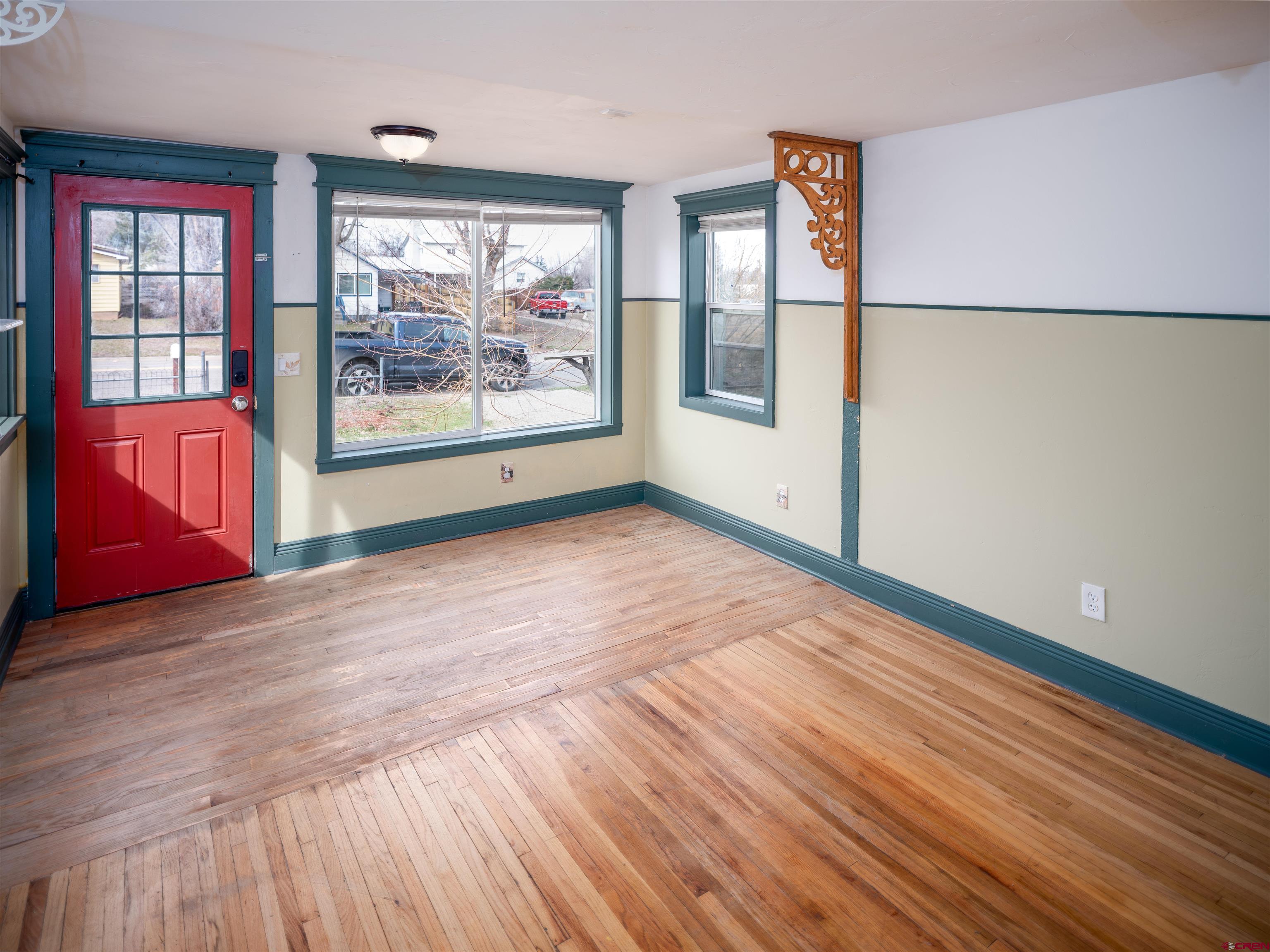 312 North Beech Street Cortez, CO 81321 - Photo 8 of 37 a view of a room with wooden floor and a window