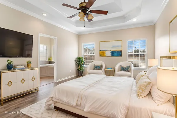 a bedroom with a large bed and a flat screen tv