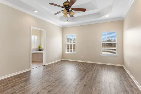 a view of livingroom with hardwood floor and a ceiling fan