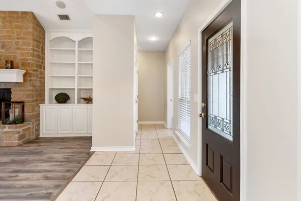 a view of a hallway with windows