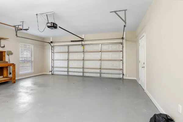 a view of a room with stairs and a flat screen tv