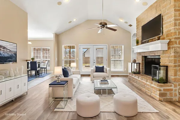 a living room with furniture fireplace and flat screen tv