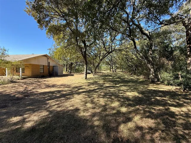 a house with trees in front of it