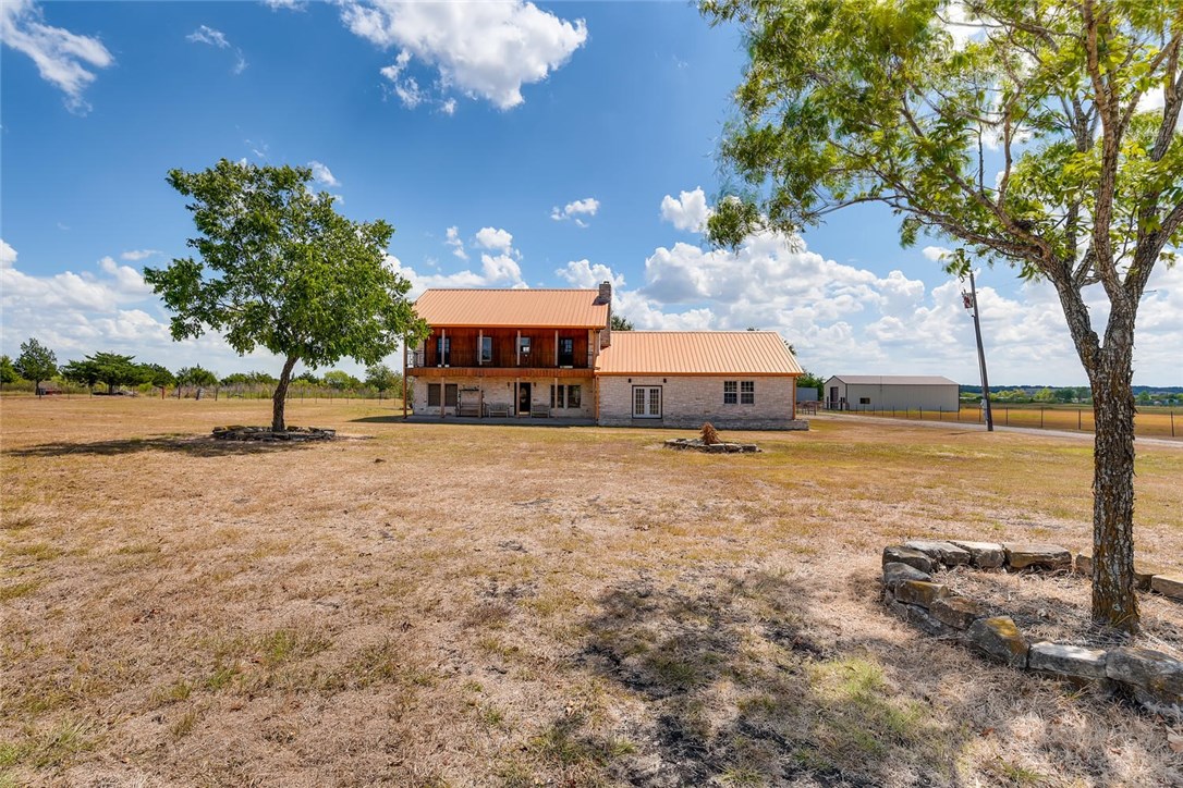 2553 Rocky Road Kyle, TX 78640 - Photo 1 of 1 a view of a house with a yard and lake view