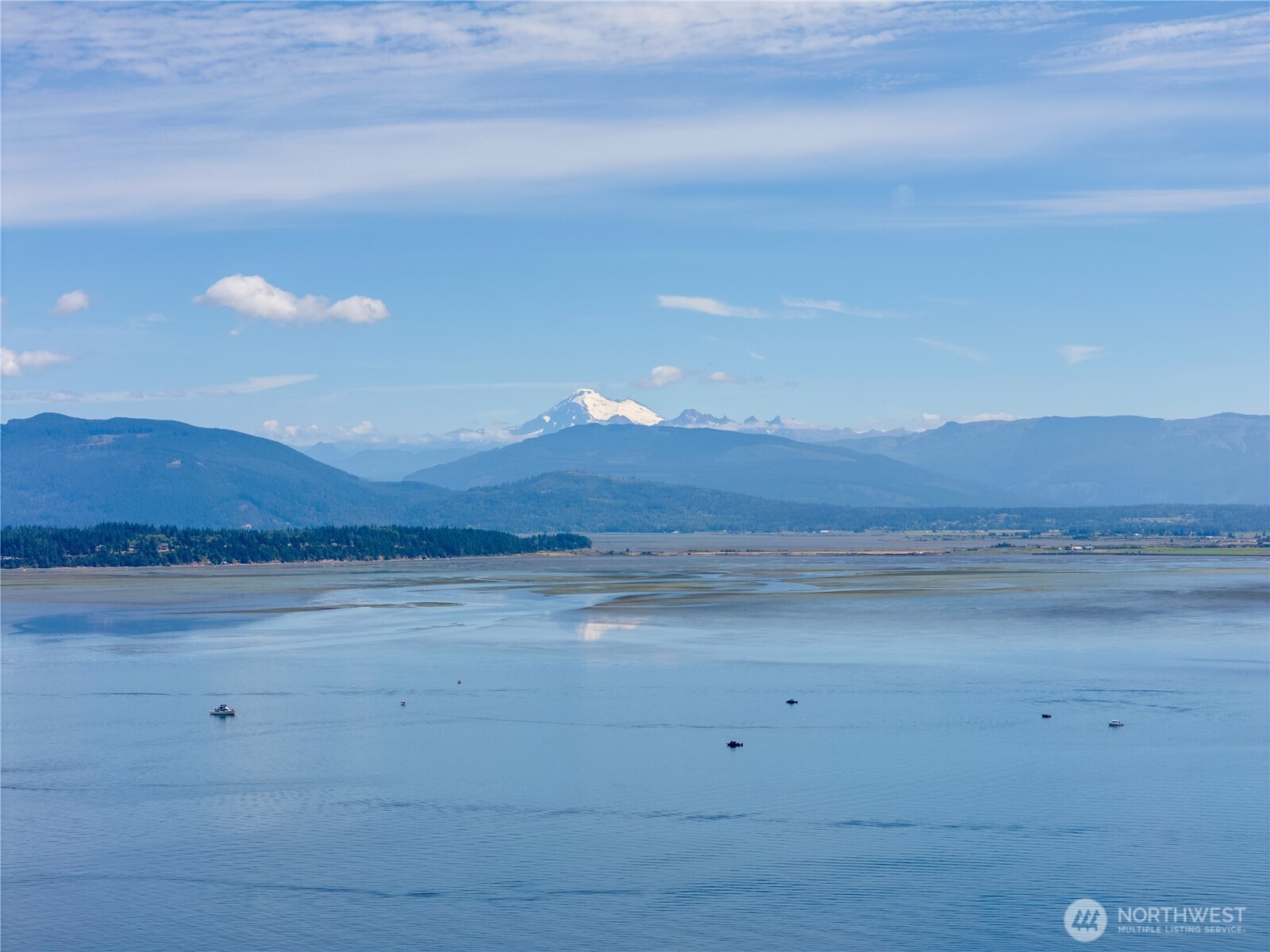 7121 Island View Drive Anacortes, WA 98221 - Photo 3 of 12 a view of an ocean beach and mountain