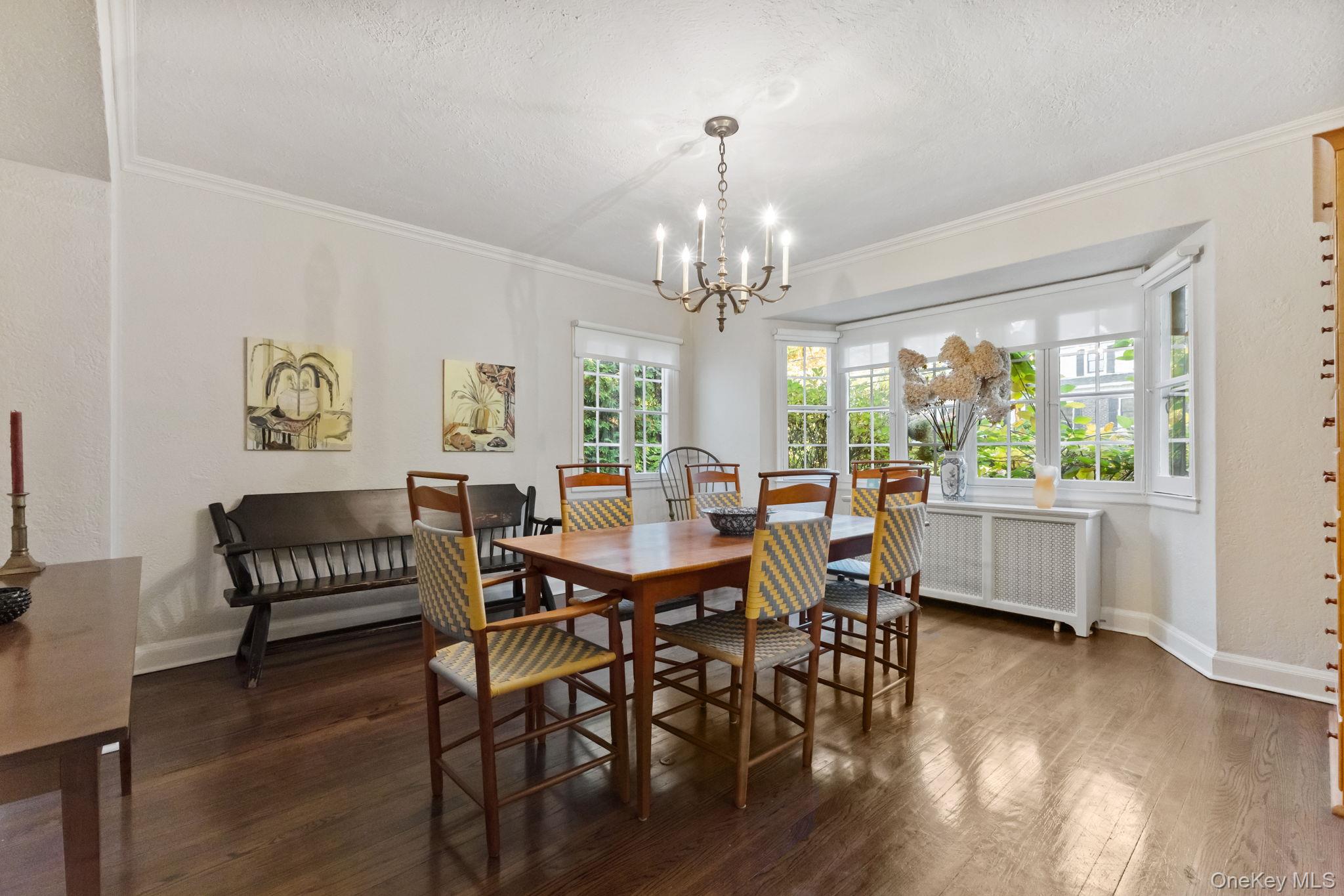 30 Studio Lane Bronxville, NY 10708 - Photo 14 of 30 a view of a dining room with furniture a chandelier and wooden floor